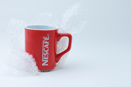 Nestle coffee mug partially wrapped
